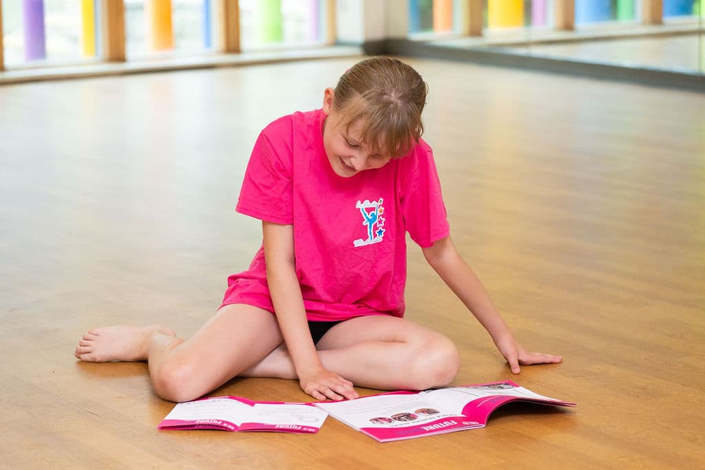 Future Dance Teacher reading course materials in the studio at En Pointe Cardiff